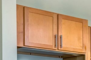 Granite Countertops, Light brown kitchen cabinets